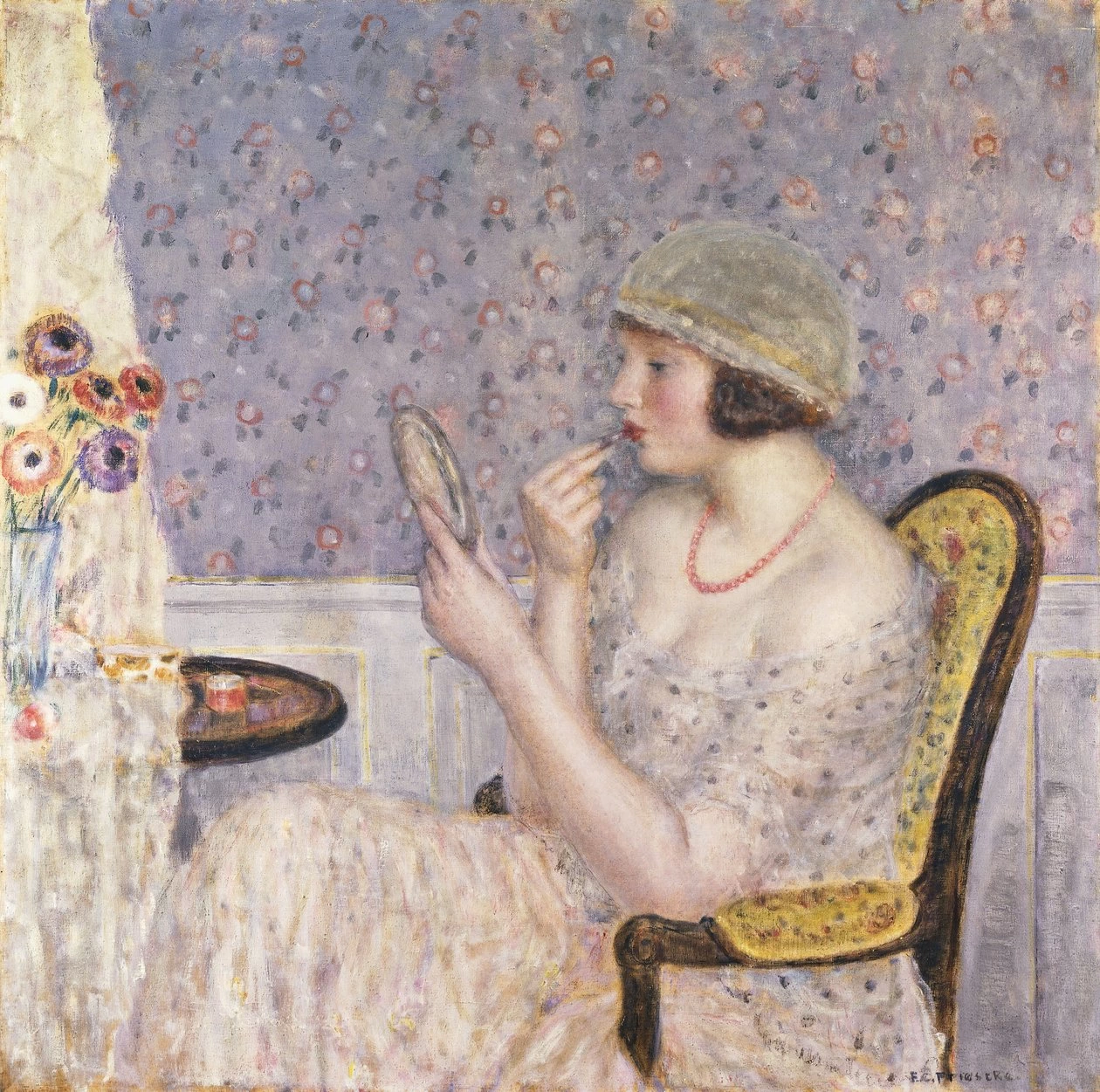 Donna a un tavolo da toeletta